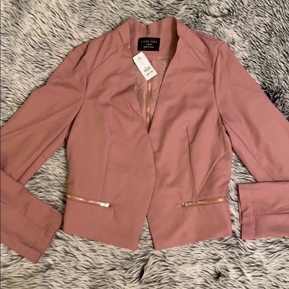 Pink Blazer with criss cross back and zipper.